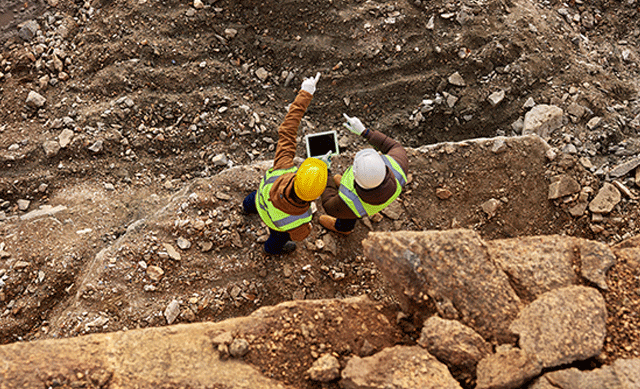 Mine workers with tablet