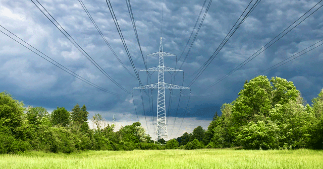 German Utility Power Line with Storm Clouds
