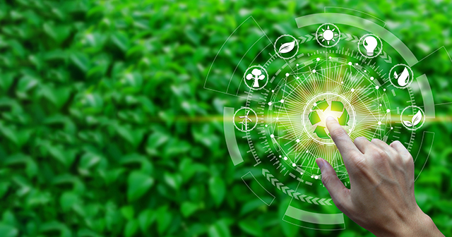 A hand touching a ‘recycle’ icon in the middle of a computer-generated image of a circular navigation menu with various agricultural icons.