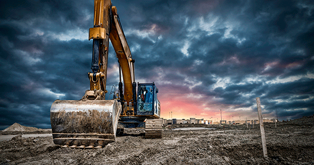 Excavator dark sky background