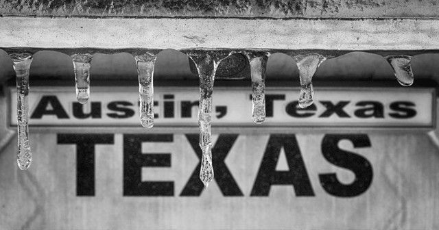 Icicles hanging in front of Austin, Texas Sign